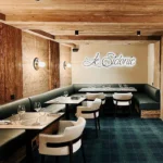 Warm wood-paneled dining room at Le Chabichou Courchevel