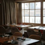 Cozy dining room with mountain views at Le Chabichou Courchevel
