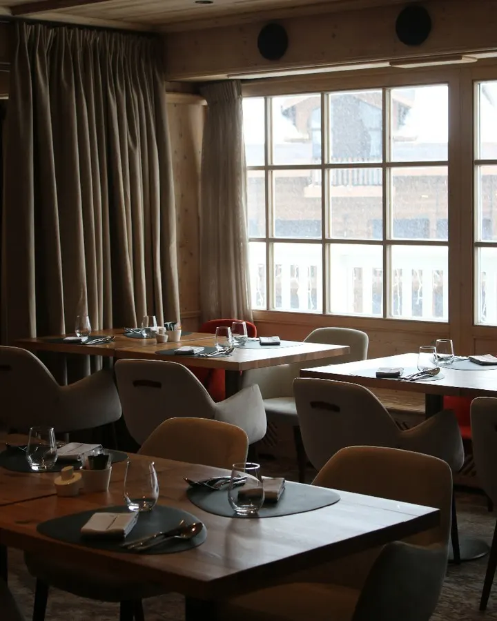 Cozy dining room with mountain views at Le Chabichou Courchevel