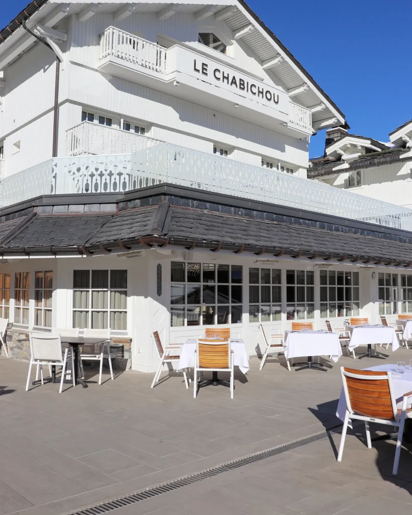 Snow-covered exterior and terrace of Le Chabichou Courchevel