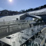 Le Chabichou Courchevel surrounded by snowy alpine scenery
