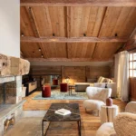 Warm alpine lounge with comfortable seating at Le Chabichou Courchevel