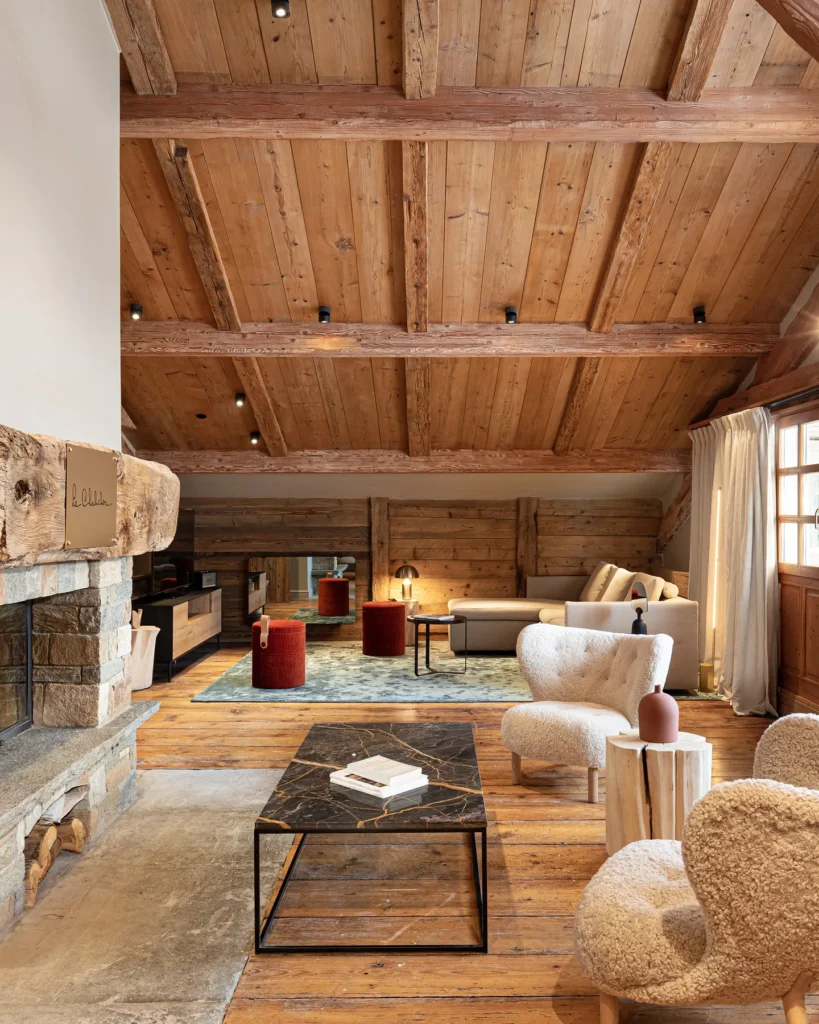 Warm alpine lounge with comfortable seating at Le Chabichou Courchevel