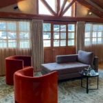 Elegant lounge with red seating at Le Chabichou Courchevel