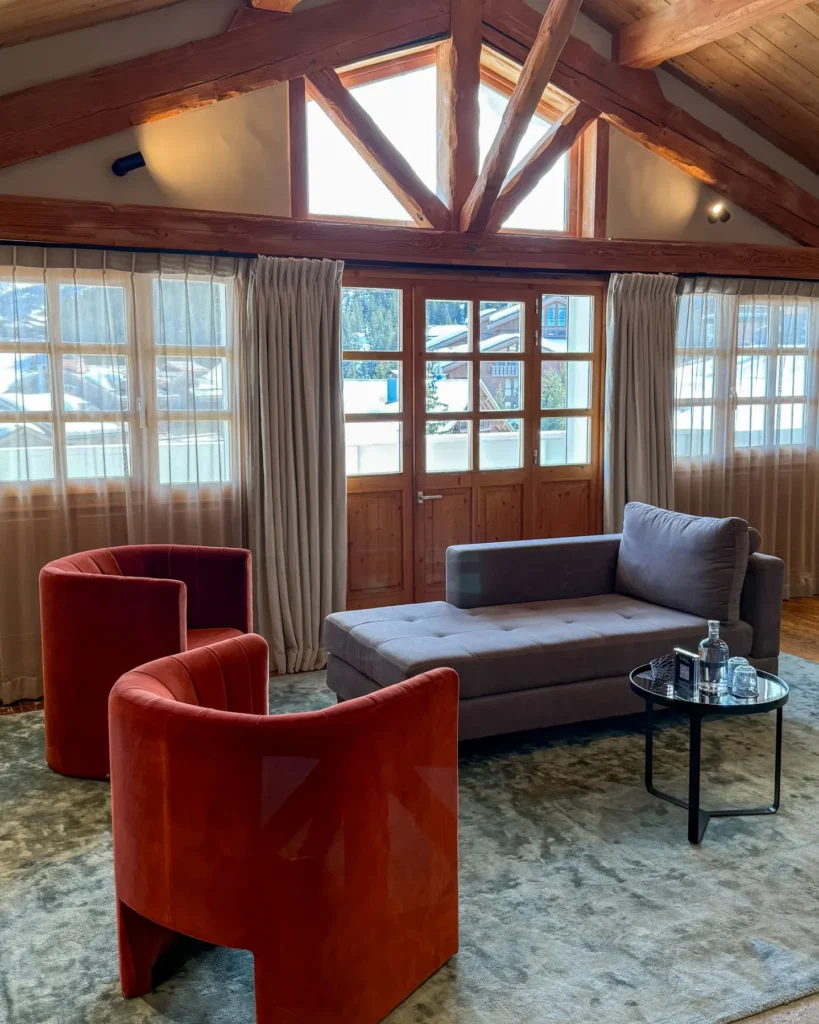 Elegant lounge with red seating at Le Chabichou Courchevel