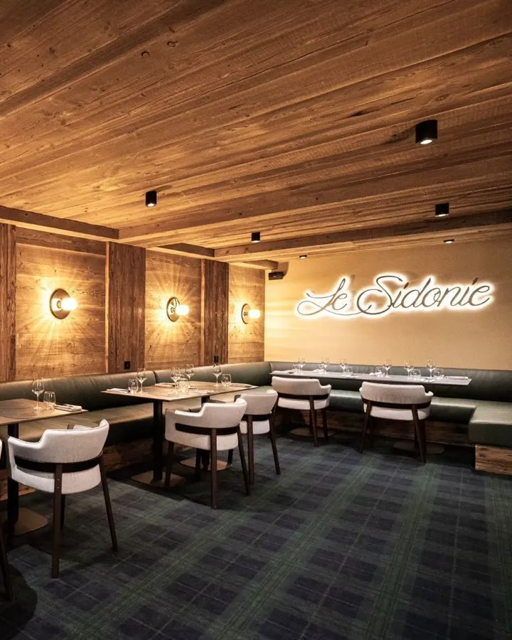 Wood-paneled restaurant interior at Le Chabichou Courchevel