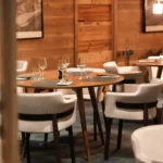 Elegant restaurant interior with wood details at Le Chabichou Courchevel