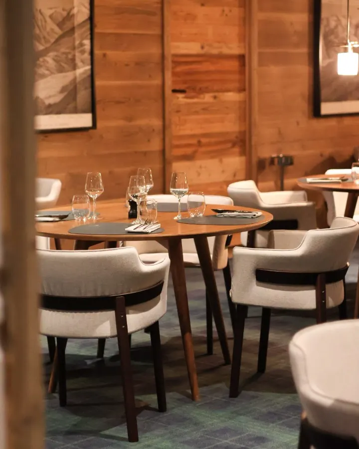 Elegant restaurant interior with wood details at Le Chabichou Courchevel