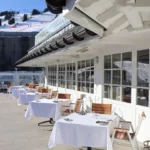 Outdoor terrace seating with mountain views at Le Chabichou Courchevel
