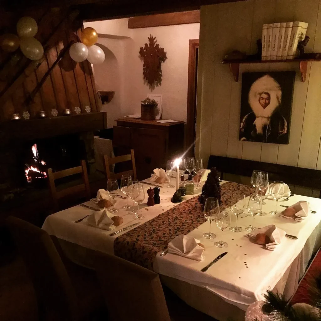Candlelit dining room with alpine decor at Le Genepi Courchevel