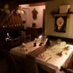 Candlelit dining room with alpine decor at Le Genepi Courchevel