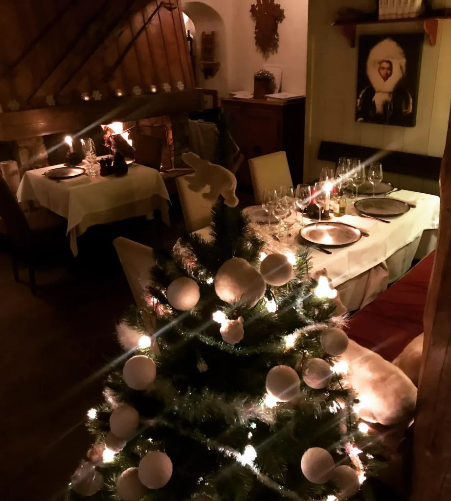 Elegant candlelit dining room at Le Genepi Courchevel