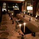 Long candlelit dining table at Le Genepi Courchevel