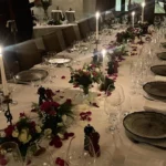 Long dining table decorated with flowers at Le Genepi Courchevel
