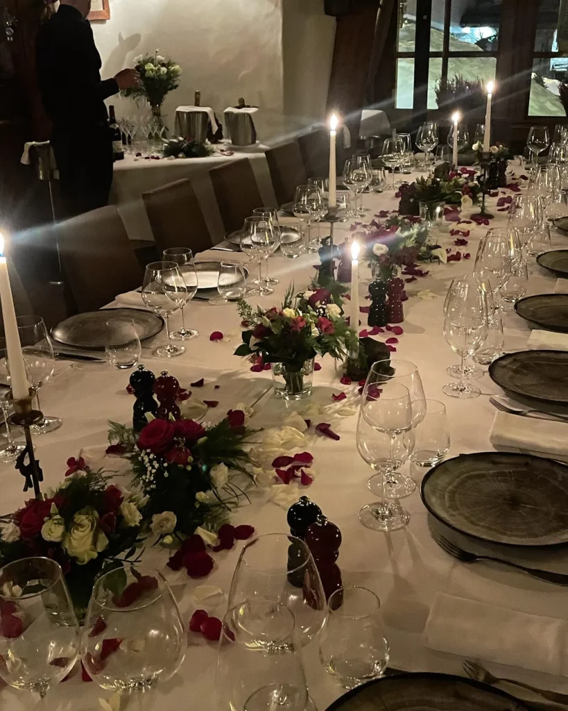 Long dining table decorated with flowers at Le Genepi Courchevel