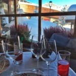 Elegant table setting beside the window at Le Genepi Courchevel