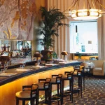 Elegant bar area inside Le Relais Plaza in Paris