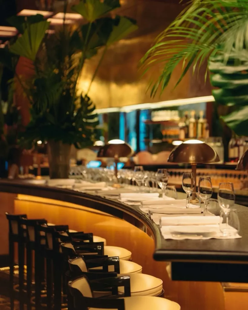 Elegant curved bar at Le Relais Plaza in Paris
