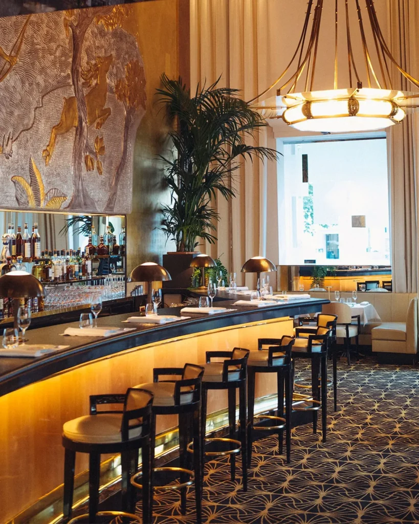 Elegant bar area inside Le Relais Plaza in Paris