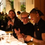 Guests dining together at Le Relais Plaza in Paris
