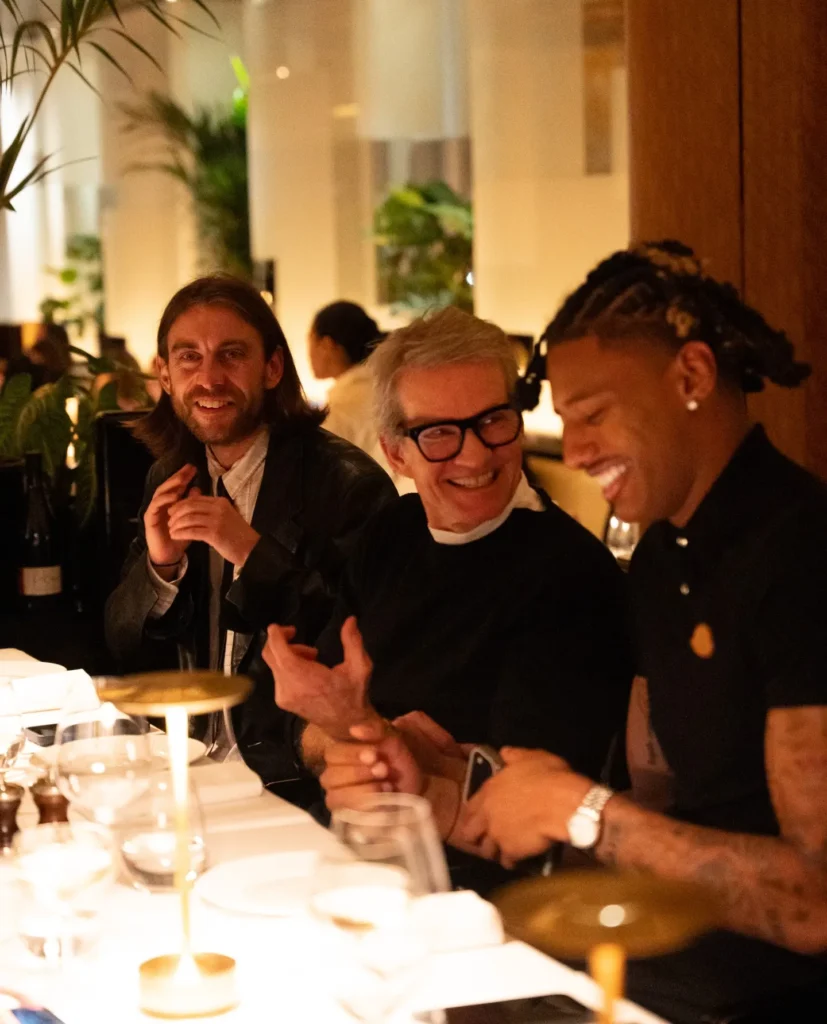 Guests dining together at Le Relais Plaza in Paris