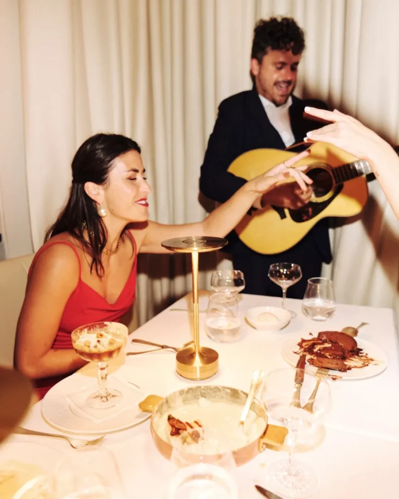 Guests enjoying a meal at Le Relais Plaza in Paris