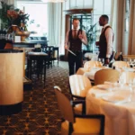 Dining area and bar inside Le Relais Plaza in Paris