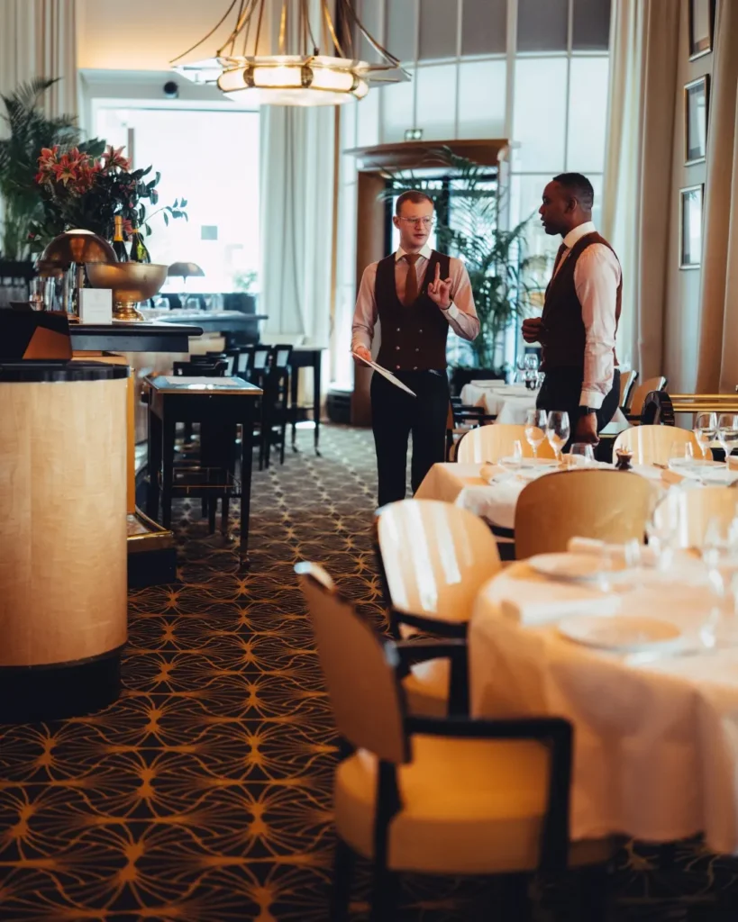 Dining area and bar inside Le Relais Plaza in Paris