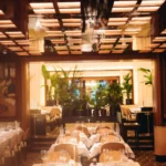 Elegant dining room with natural light at Le Relais Plaza in Paris