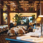 Warmly lit dining room at Le Relais Plaza in Paris