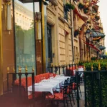 Parisian exterior and outdoor seating at Le Relais Plaza