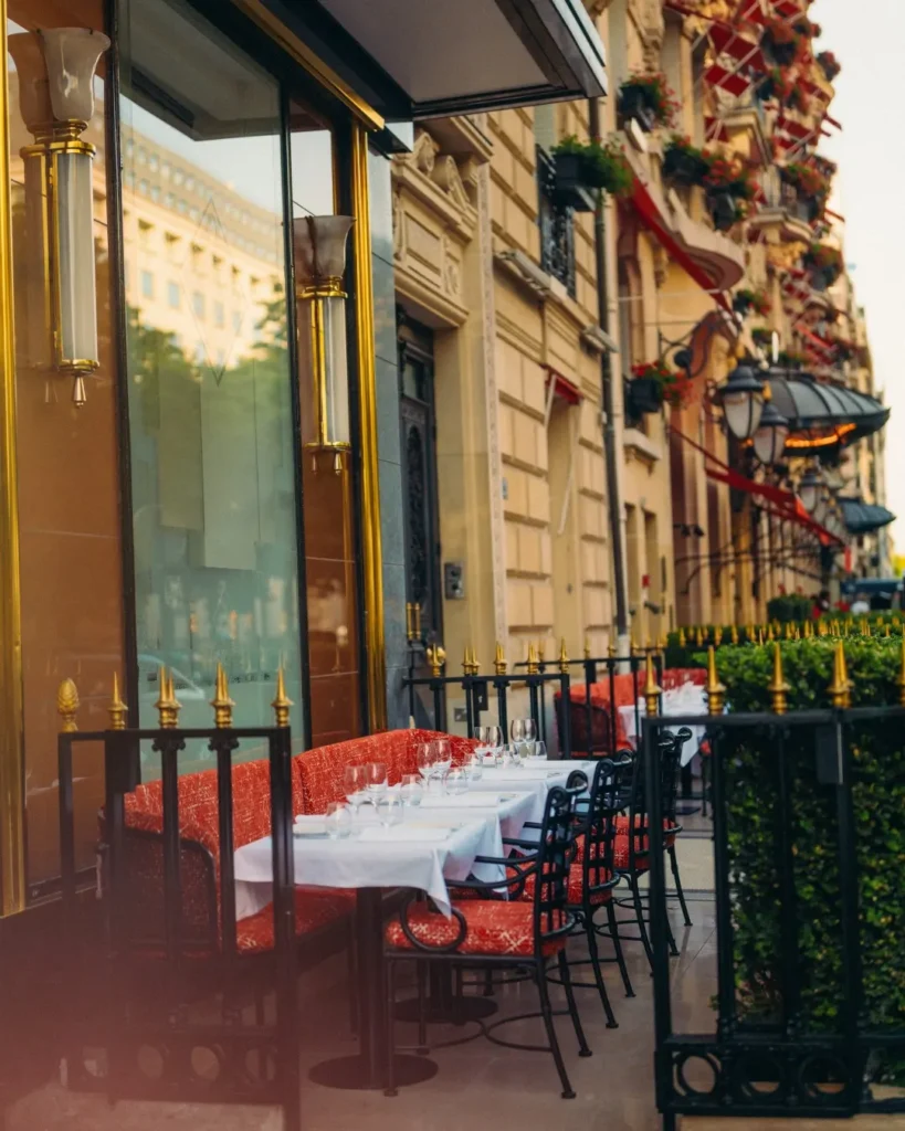 Parisian exterior and outdoor seating at Le Relais Plaza