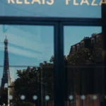 Le Relais Plaza sign displayed on the Parisian exterior