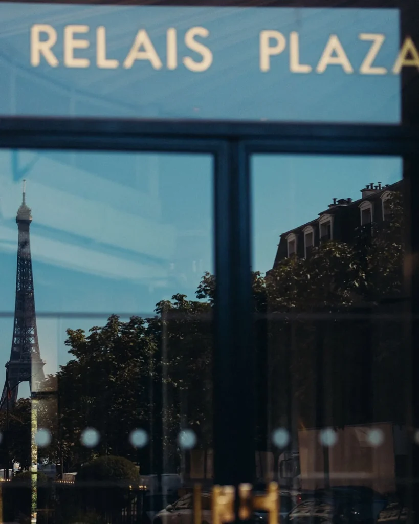 Le Relais Plaza sign displayed on the Parisian exterior