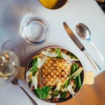 Gourmet plate served at Le Relais Plaza in Paris