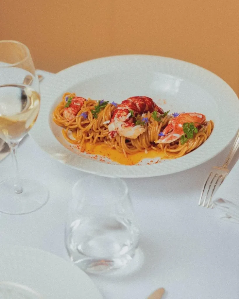 Colorful gourmet dish served at Le Relais Plaza in Paris