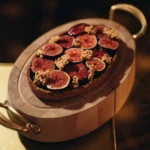 Gourmet dish served at Le Relais Plaza in Paris