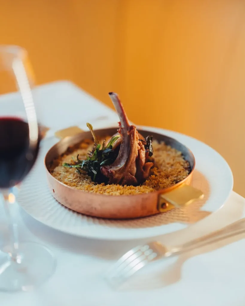 Gourmet dish served at Le Relais Plaza in Paris