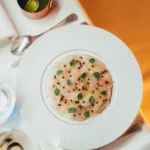 Gourmet soup dish served at Le Relais Plaza in Paris