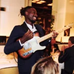 Live musician performing inside Le Relais Plaza in Paris