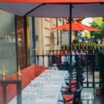 Outdoor terrace seating at Le Relais Plaza in Paris