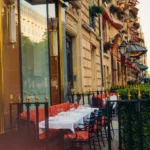 Outdoor restaurant terrace along a Parisian street at Le Relais Plaza