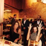 Guests celebrating together inside Le Relais Plaza in Paris