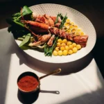 Seafood dish served at Le Relais Plaza in Paris