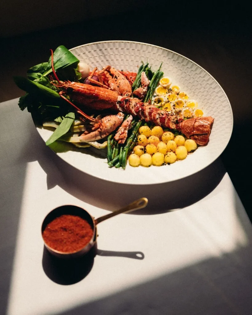 Seafood dish served at Le Relais Plaza in Paris