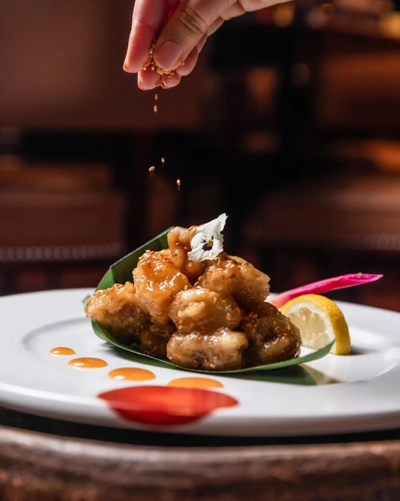 Gourmet dish served at Le Royal Monceau Paris