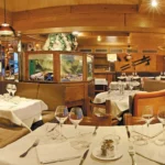 Elegant wooden dining room at Le Tremplin Courchevel