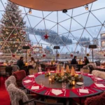 Covered terrace dining area at Le Tremplin Courchevel with red tablecloths