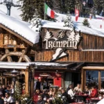 Exterior of Le Tremplin restaurant in Courchevel with its wooden chalet facade