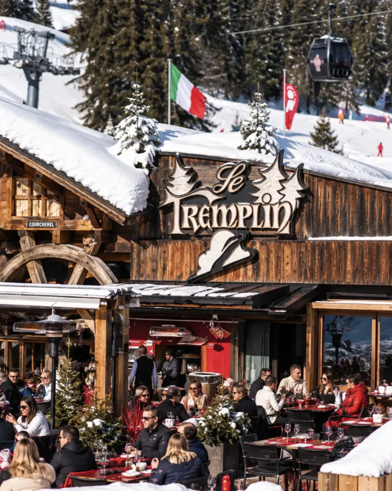 Exterior of Le Tremplin restaurant in Courchevel with its wooden chalet facade